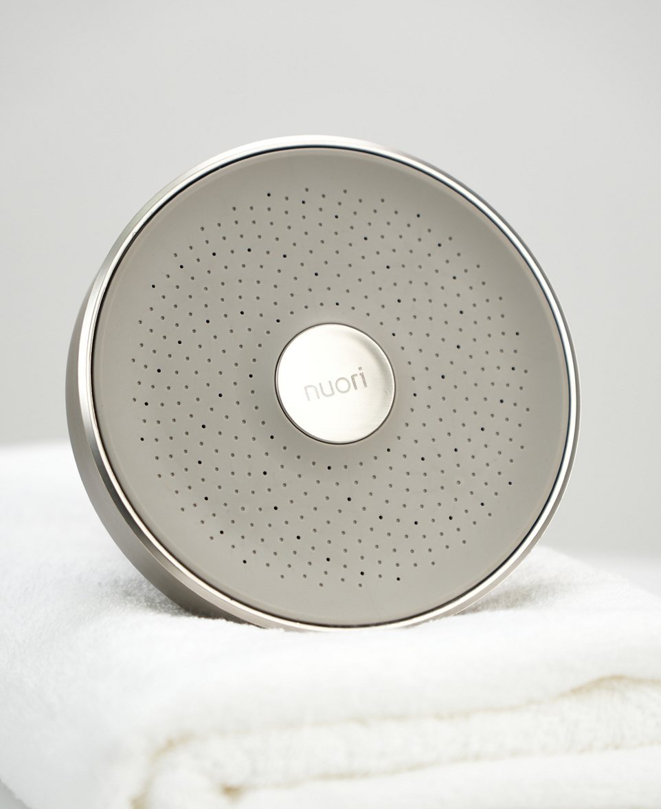 Nickel Nuori showerhead resting on a white towel