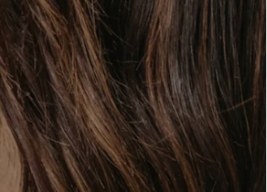 Close-up of dark brown hair strands