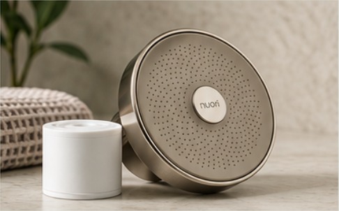 Nickel Nuori showerhead beside its replacement filter